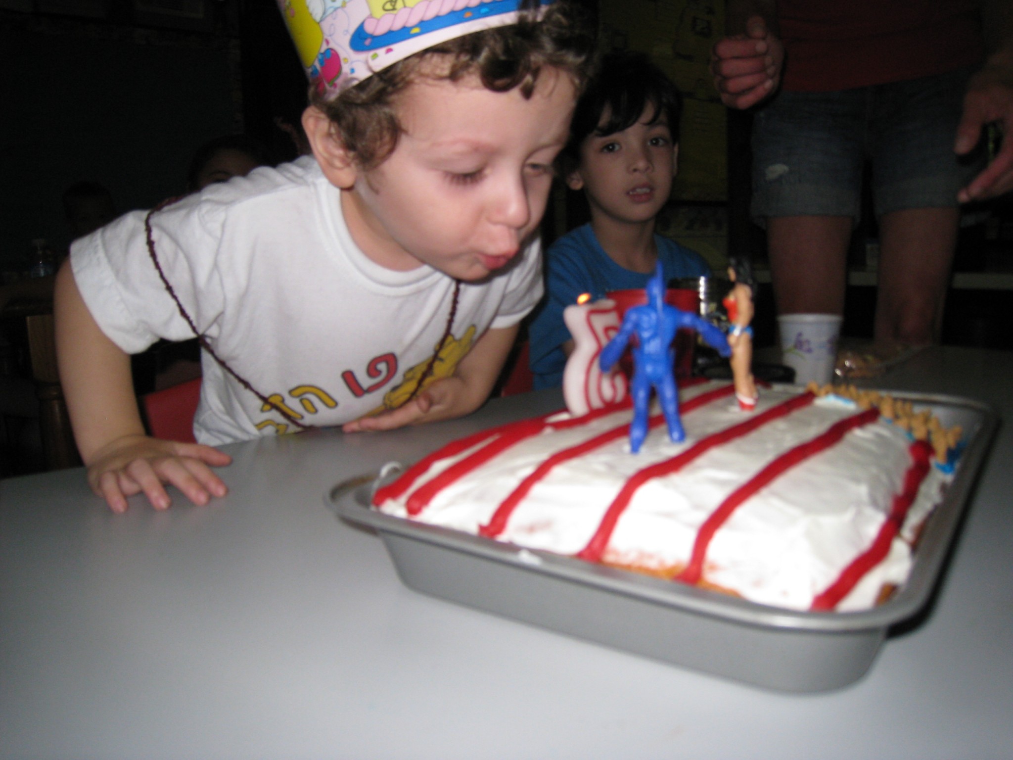 My son's 3rd birthday cake- Wonder Woman (and the toy she came with, Omac) 